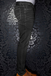 Au Noir men's black jeans side view with contrast stitching, back pocket, and waistband patch