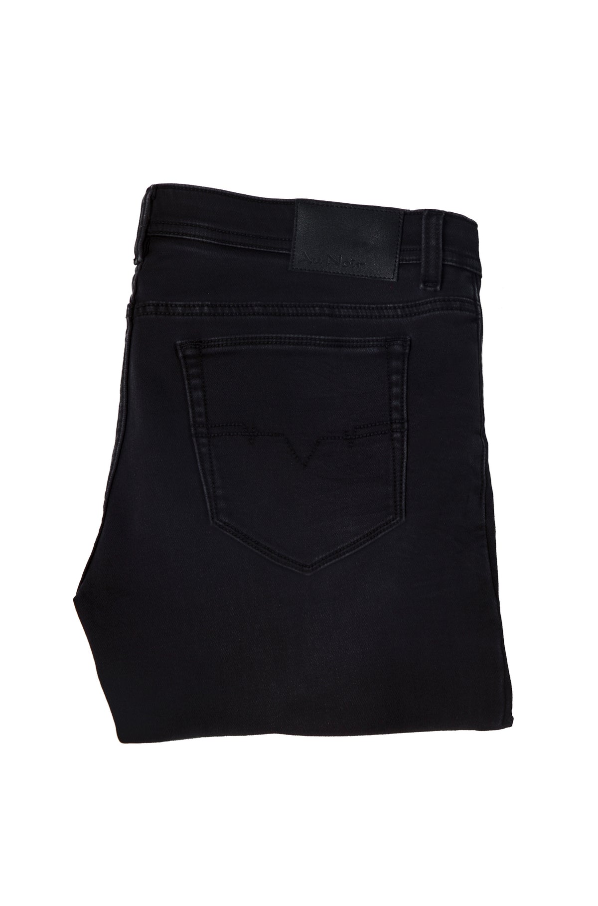 Au Noir men's folded black jeans showing back pocket, belt loops, tonal stitching, and black logo patch, detail view