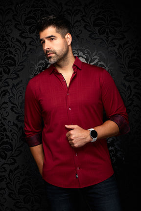 Men's burgundy button-up shirt in angled front view with rolled black and red patterned cuffs by Au Noir