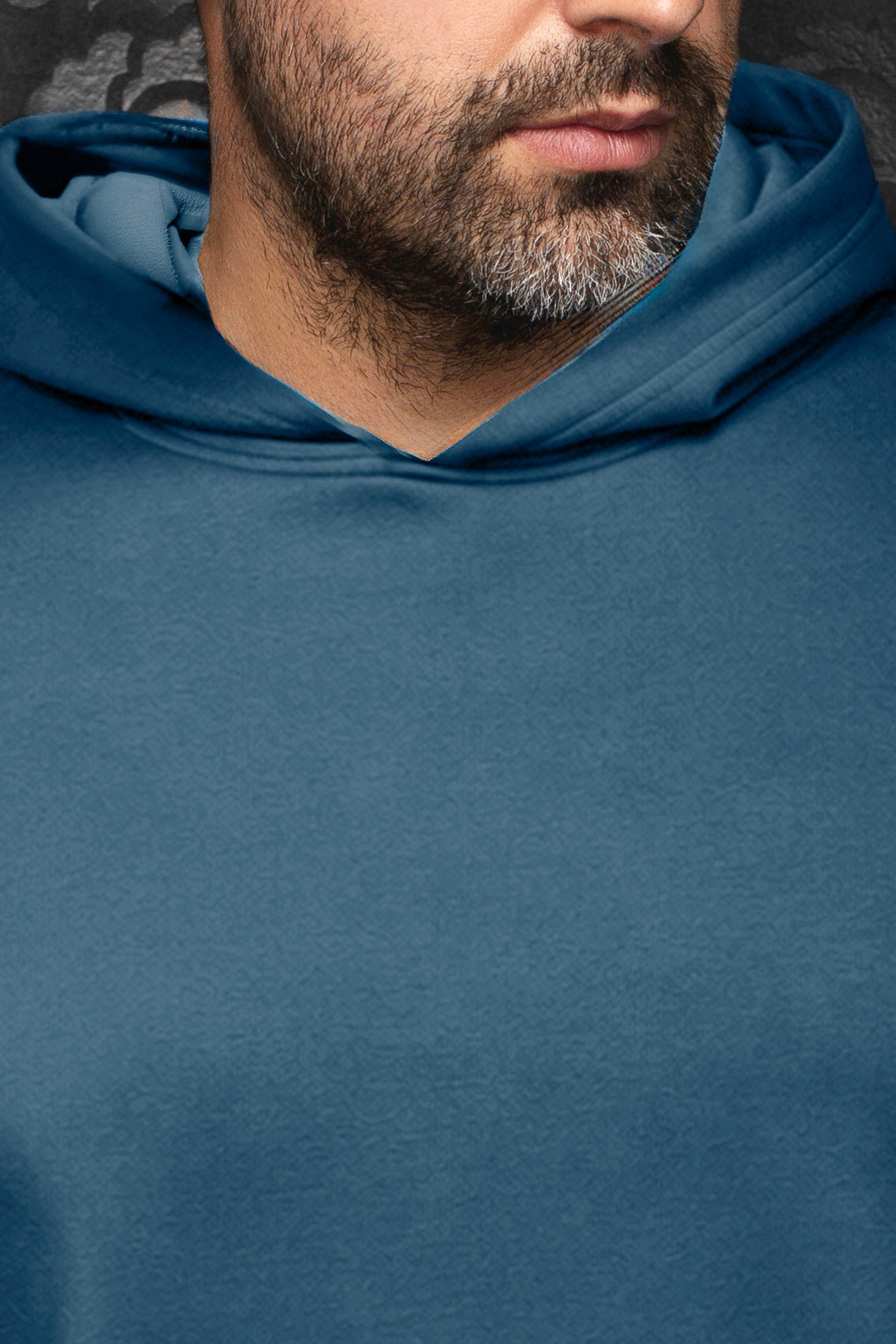 Close-up of men's teal blue sport jacket neckline and hood, showing subtle tonal paisley texture by Au Noir