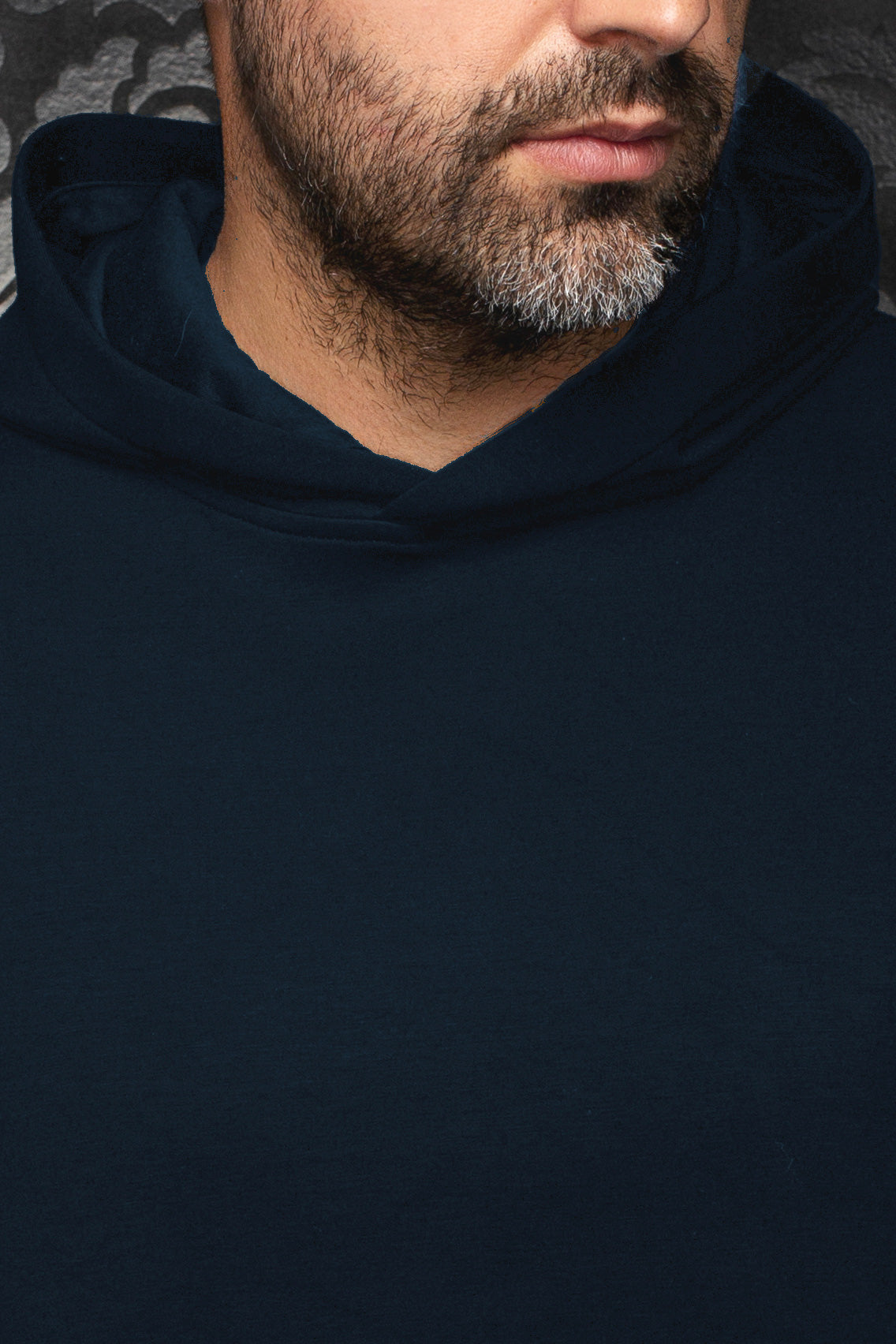 Au Noir men's navy pullover sports jacket showing the hooded neckline and smooth plain front, close-up