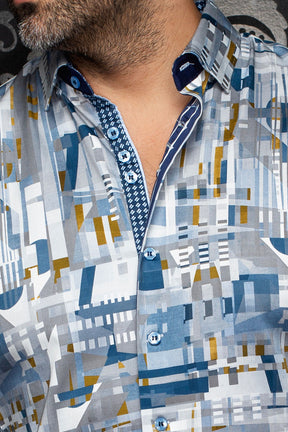 Au Noir men's gray geometric print button-up shirt with blue buttons and navy contrast placket, close-up