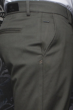 Au Noir men's olive chino pants showing rear waistband, belt loops, welt pocket, and logo trims, close-up