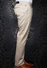 Au Noir men's beige chino pants showing slim straight leg, back welt pocket, and black patch, side view