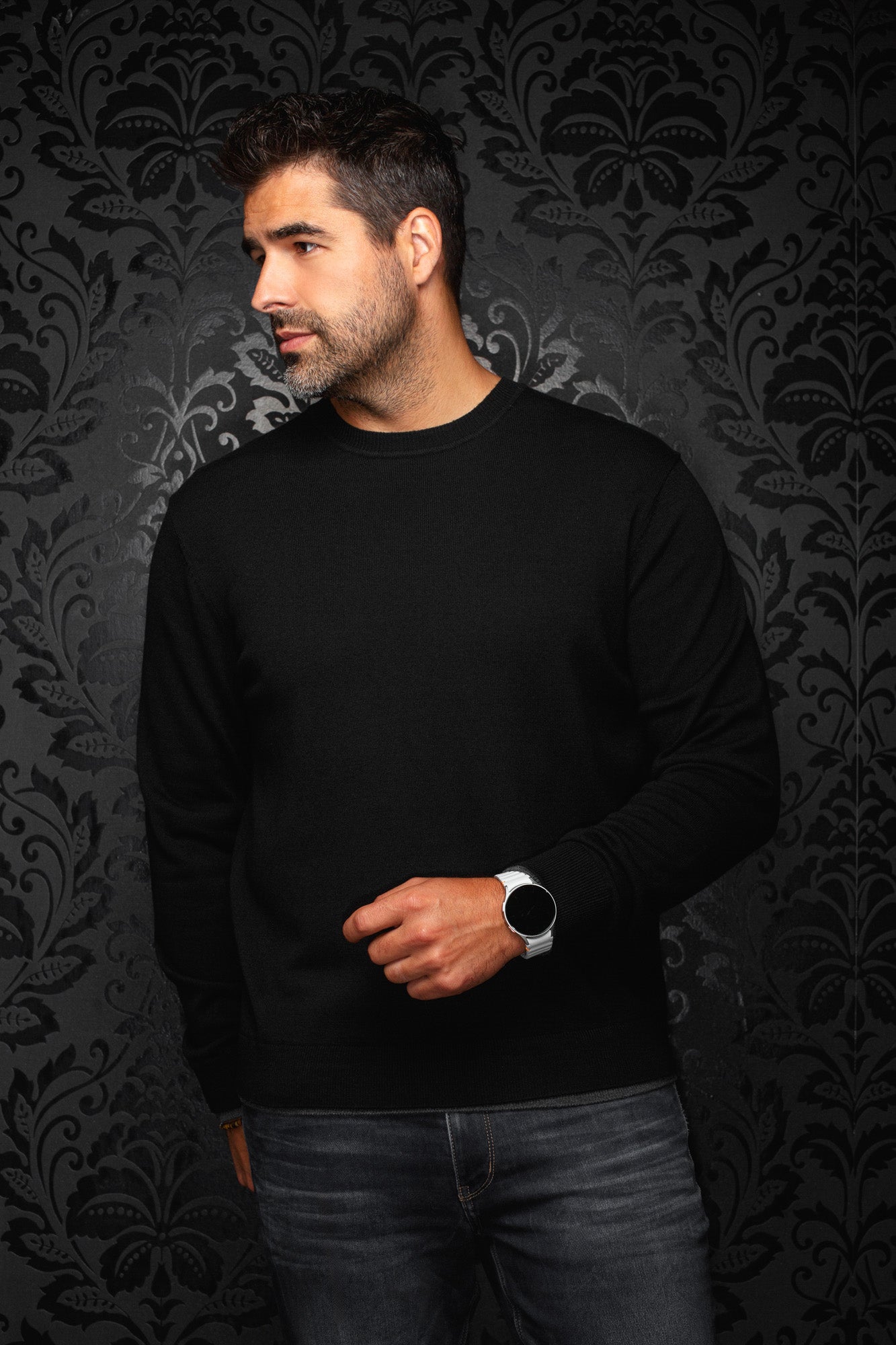 Au Noir men's solid black crewneck knit cashmere sweater with ribbed cuffs and hem, front model view