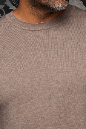 Au Noir men's taupe knit cashmere sweater showing ribbed crewneck collar and fine knit texture, close-up