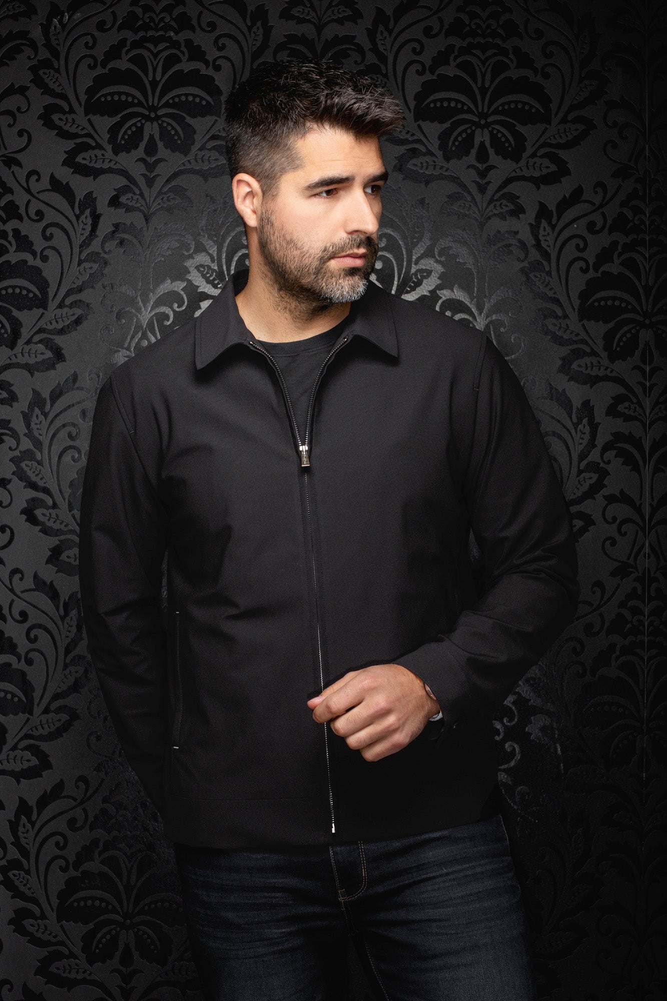 Au Noir men's black zip-front bomber jacket with pointed collar, long sleeves, and banded hem, front model view