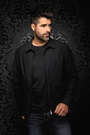 Au Noir men's black zip bomber jacket worn open with a pointed collar and metal zipper shown from the front