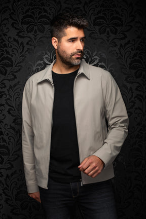 Au Noir men's light gray zip-front bomber jacket worn open, showing pointed collar, metal zipper and banded hem