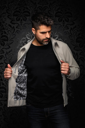 Men's open light gray bomber jacket showing black and white wavy printed lining and metal zipper, detail view by Au Noir