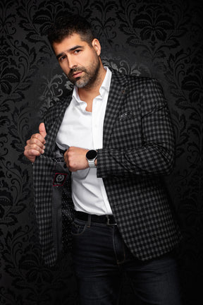 Au Noir men's angled view of black and gray check blazer opened to show dark patterned lining and label, detail view