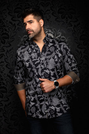 Au Noir men's black button-up shirt with white botanical print and rolled patterned cuffs, front view