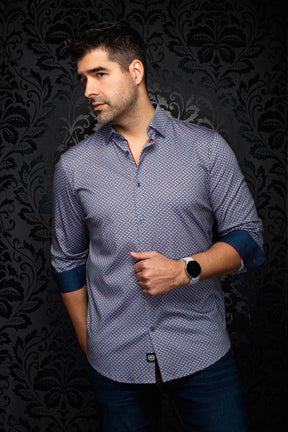 Men's angled view of blue geometric print button-up shirt with rolled sleeves and contrast cuffs, side view by Au Noir