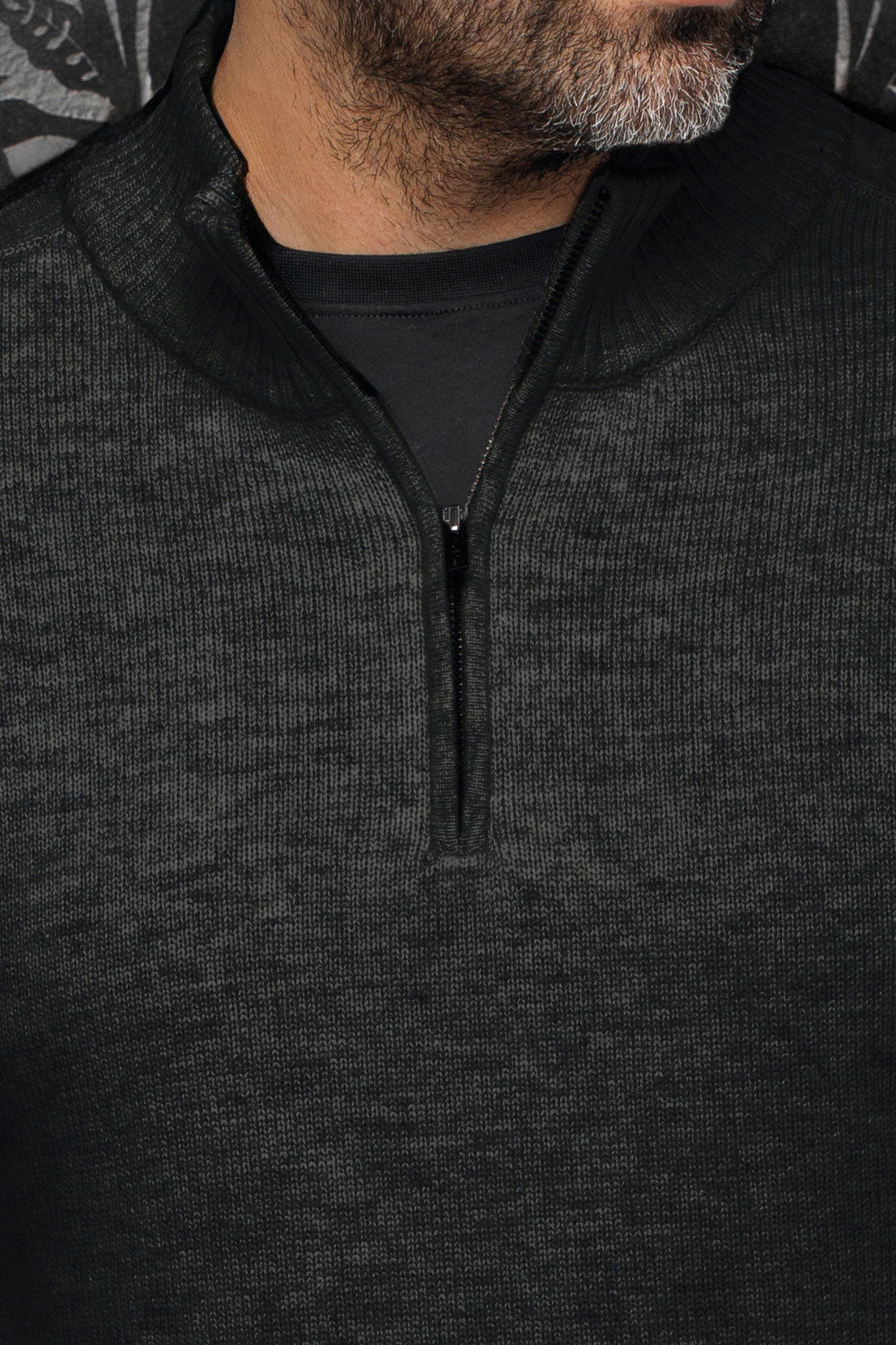 Au Noir men's black textured knit cashmere sweater with mock collar and short zipper at the neckline, close-up