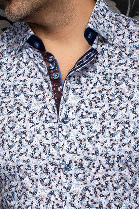 Au Noir men's white floral shirt collar, blue buttons, and navy and burgundy contrast placket, close-up