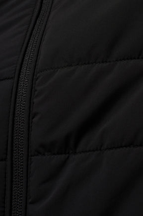 Psycho Bunny men's black quilted windbreaker jacket fabric with horizontal stitching and front zipper, close-up