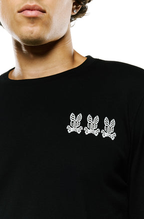 Men's front chest detail of black long sleeve T-Shirt with three white bunny logos and ribbed crewneck by Psycho Bunny