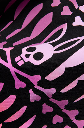 Close-up detail of men's pink Psycho Bunny skull-and-bones graphic printed on black Short-sleeve T-Shirt fabric