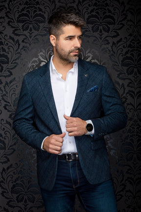 Au Noir men's navy textured blazer with notched lapels, flap pockets, cuff buttons, and lapel pin, front view