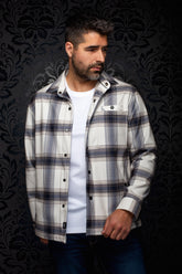 Au Noir men's off-white plaid overshirt on model, front view with black snaps and chest flap pocket
