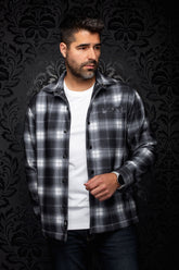 Au Noir men's black and gray plaid overshirt with snap front, chest pocket, and spread collar shown from the front