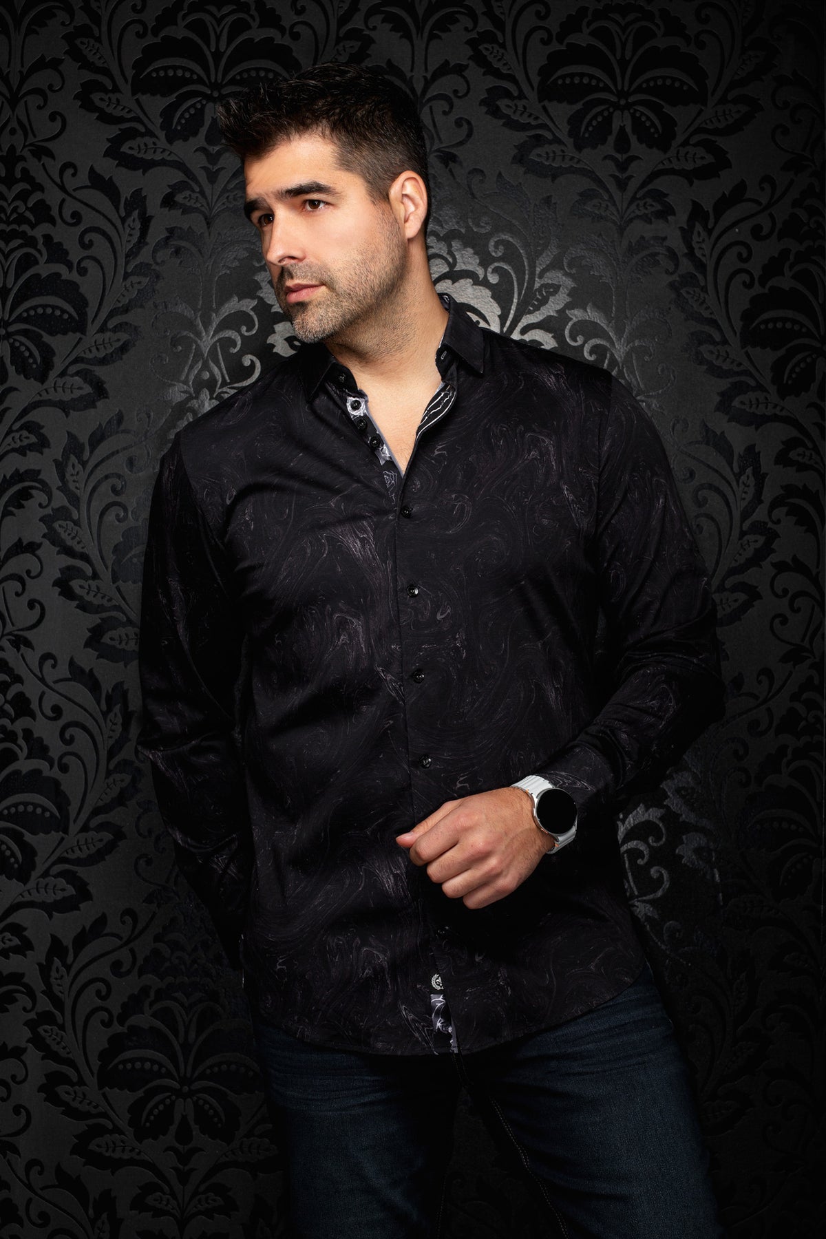 Men's black tonal paisley button-up shirt, front model view with open collar and black buttons by Au Noir