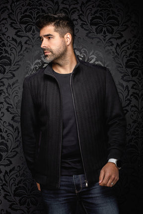 Men's black bomber jacket worn open, with herringbone front panels and silver zipper by Au Noir