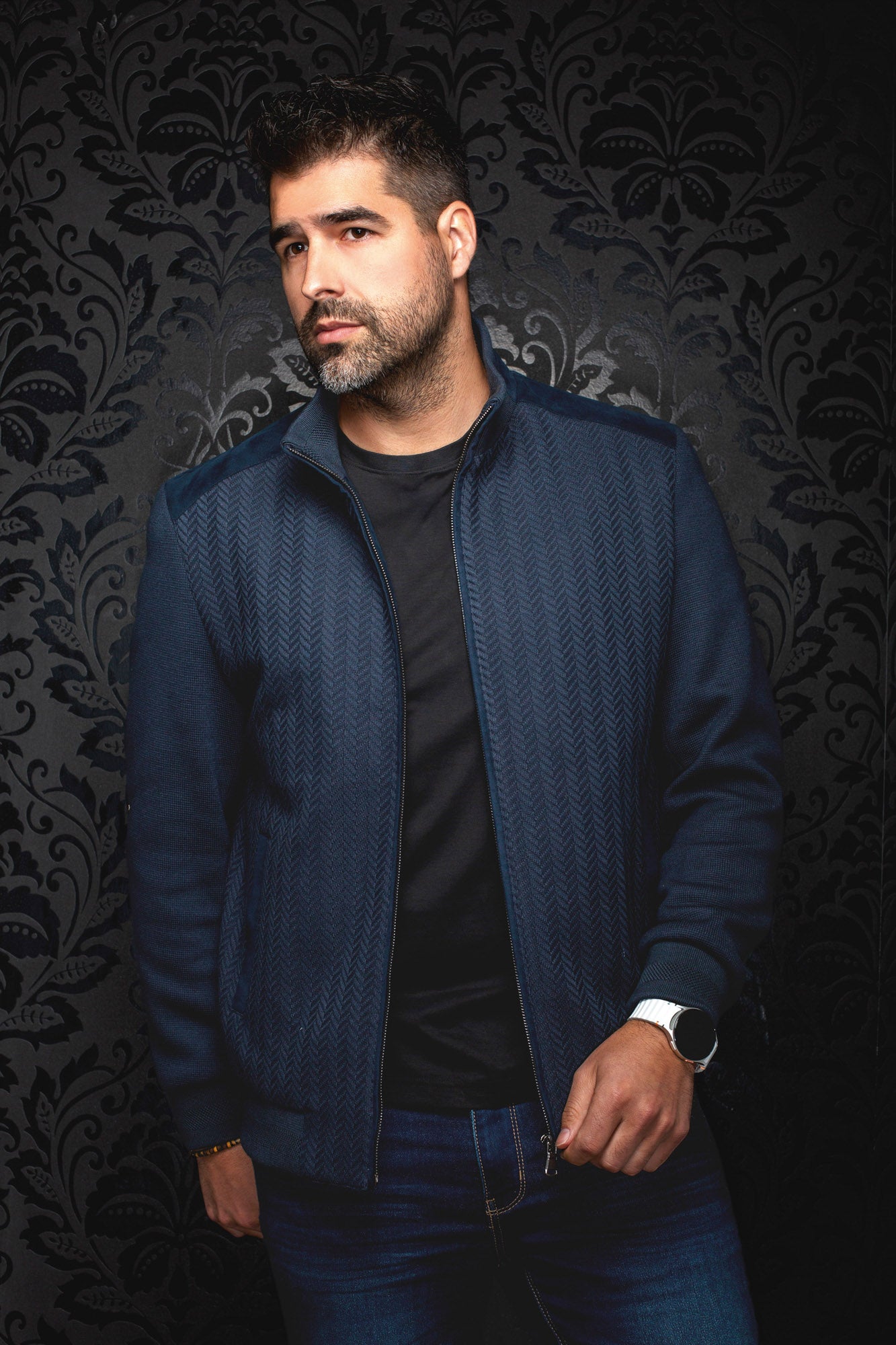 Au Noir men's navy bomber jacket worn open, front view with herringbone texture and ribbed cuffs