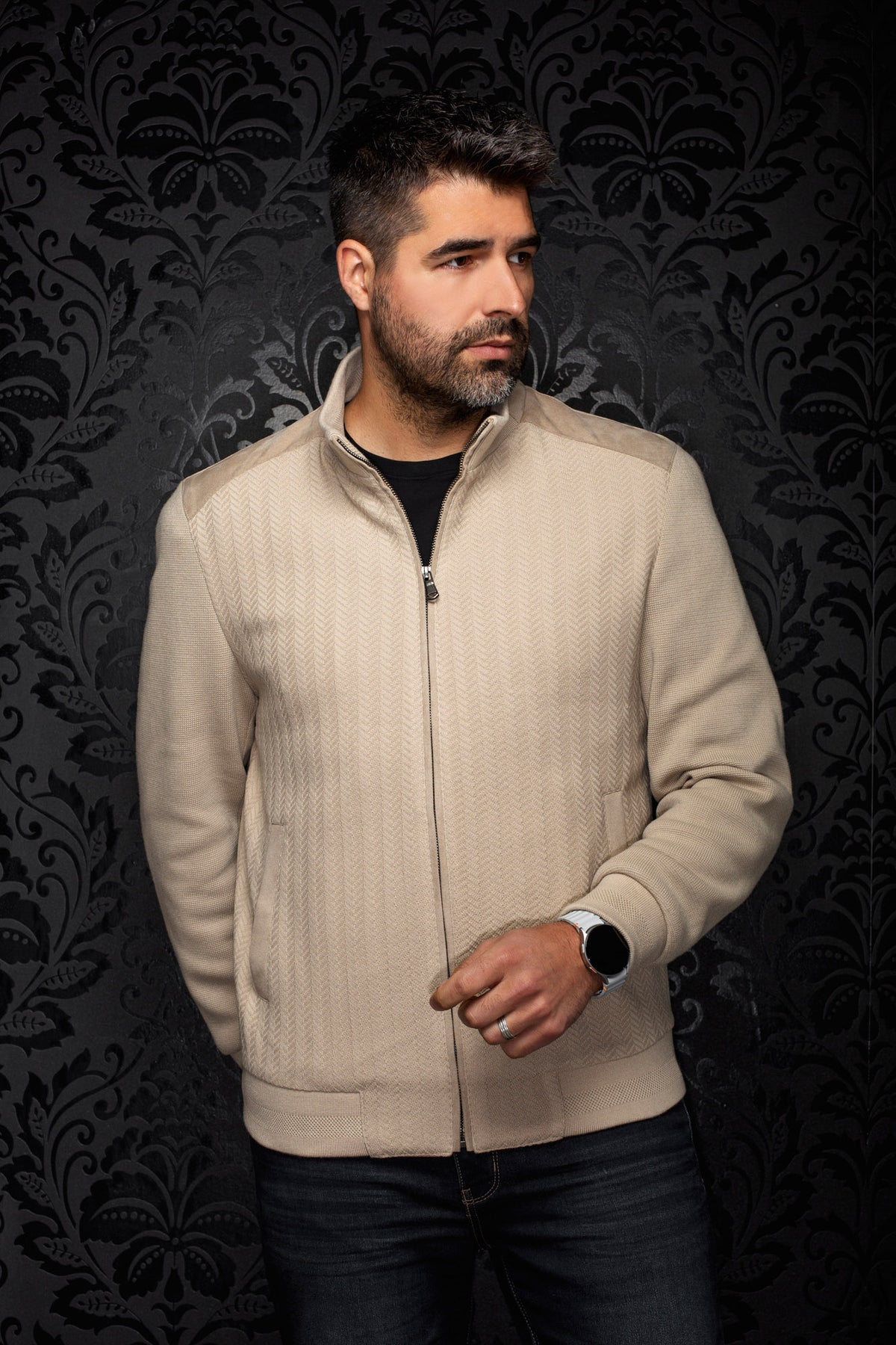 Men's beige zip bomber jacket on model, front view with stand collar, ribbed hem and herringbone texture by Au Noir