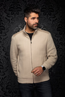 Men's beige zip bomber jacket on model, front view with stand collar, ribbed hem and herringbone texture by Au Noir