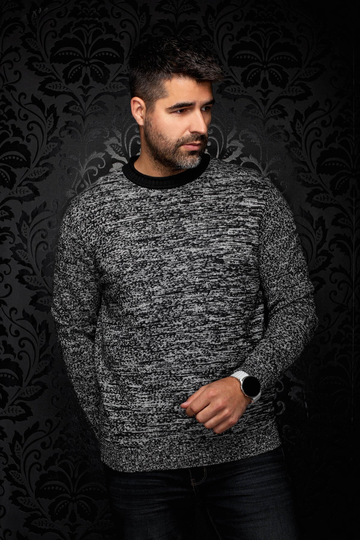 Front view of gray marled crewneck knit cashmere sweater with black ribbed trim on a male model by Au Noir