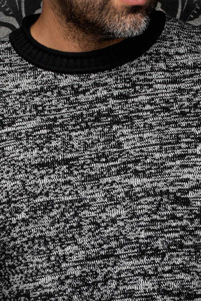 Au Noir men's gray marled knit cashmere sweater showing the black ribbed crew neck and textured yarn, close-up