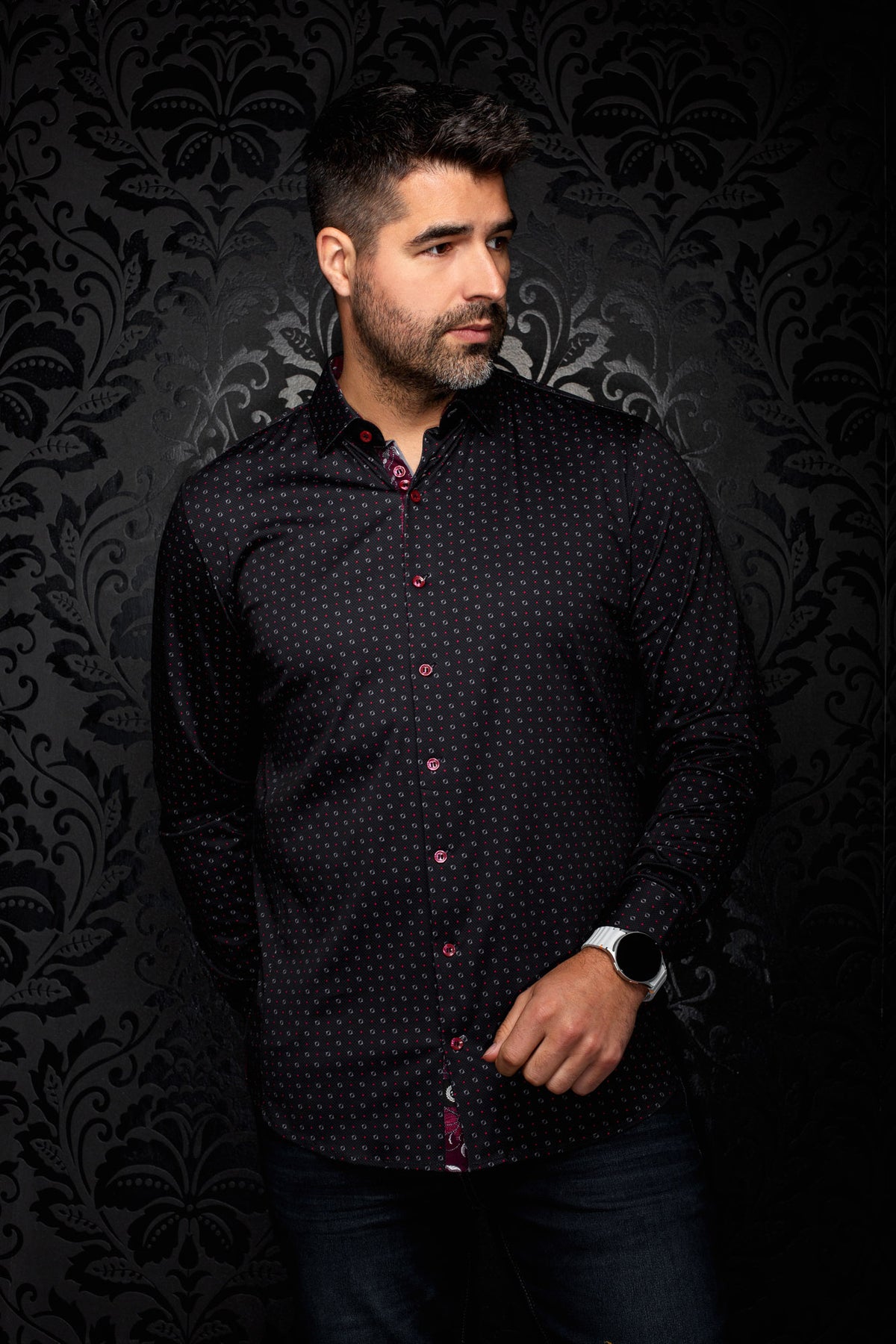 Au Noir men's black button-up shirt with red buttons and small red and gray geometric print, front model view