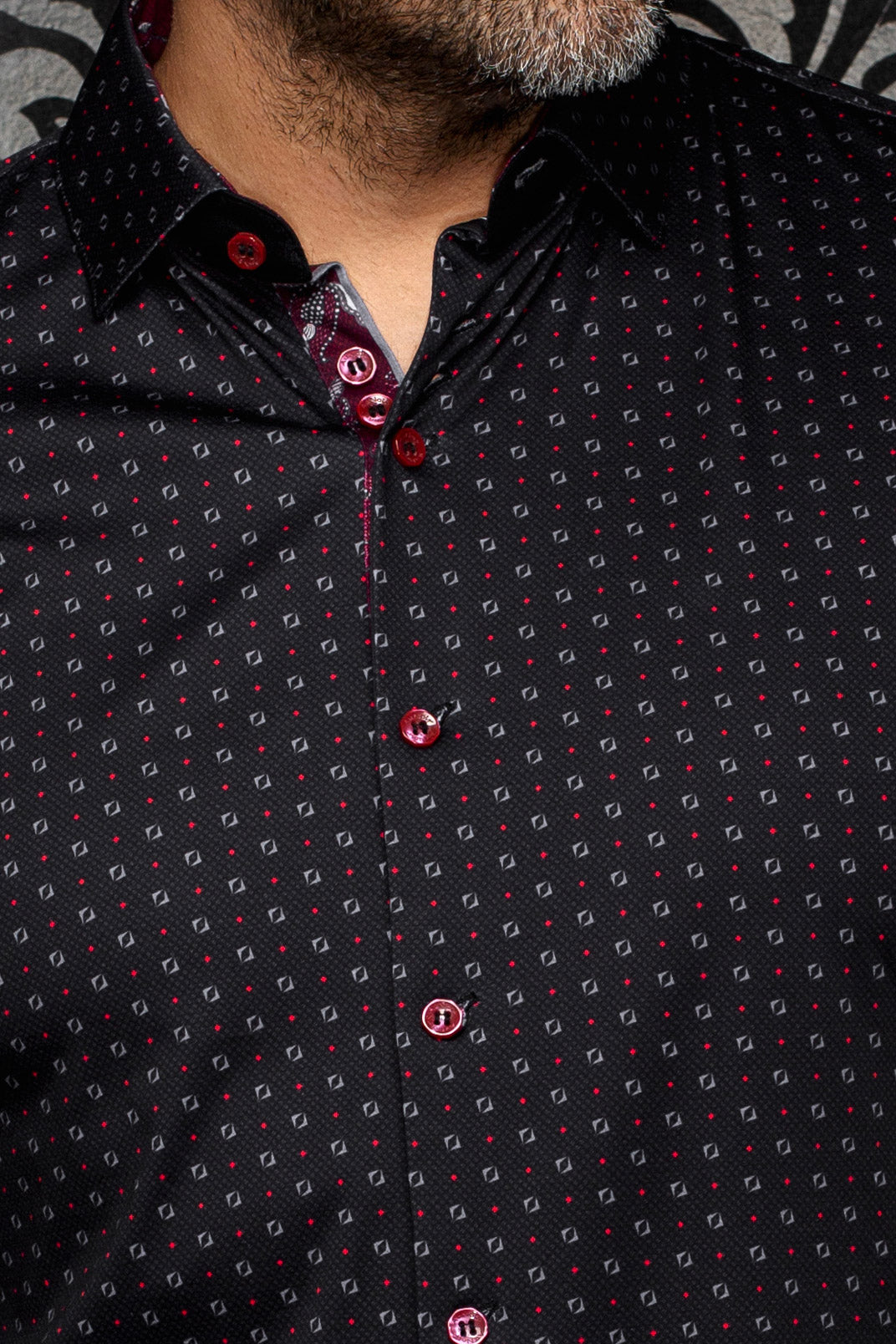 Au Noir men's black button-up shirt with red buttons, micro geometric print, and contrast placket, close-up
