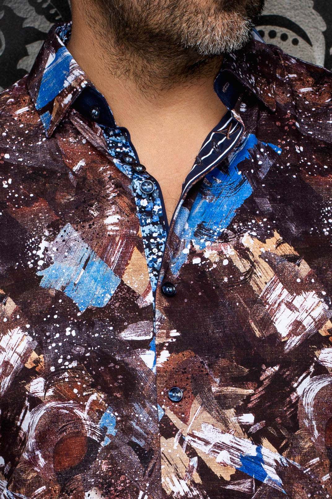 Au Noir men's brown abstract print shirt collar, dark buttons, and contrast inner placket, close-up