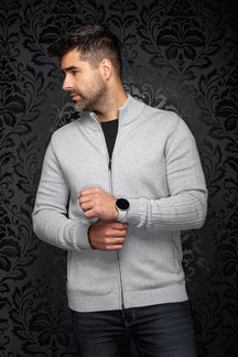 Men's front angled view of light gray full-zip knit cashmere sweater with stand collar and ribbed hem by Au Noir