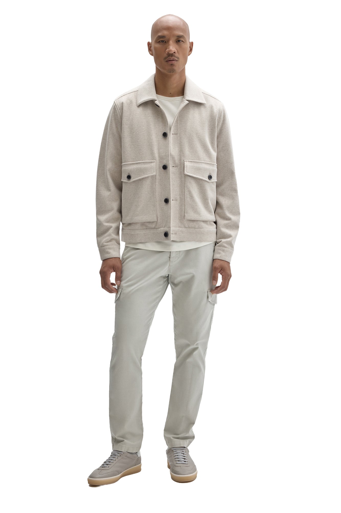 Men's full front view of cream textured button-front jacket with dark buttons and flap pockets by Robert Barakett