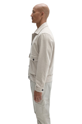 Robert Barakett men's cream textured button-front jacket with cuff tab, dark buttons and flap pocket shown from the side