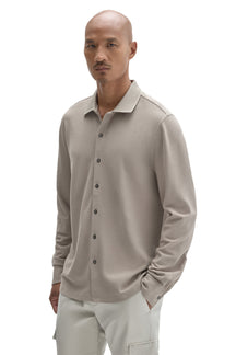 Robert Barakett men's front angled view of a light taupe long sleeve knit button-front shirt with ribbed collar