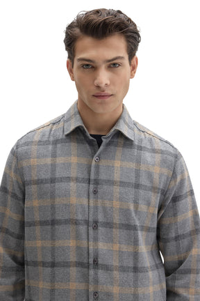 Men's close front view of gray plaid flannel overshirt showing collar and front buttons by Robert Barakett