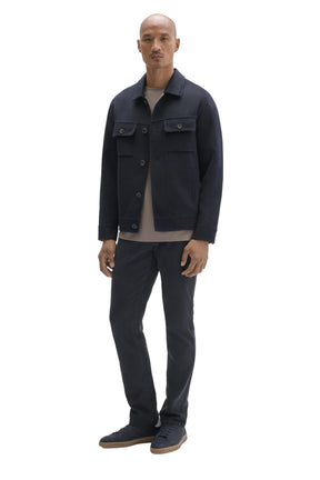 Men's full-length front view of dark navy button-front jacket styled over a light crewneck T-Shirt by Robert Barakett