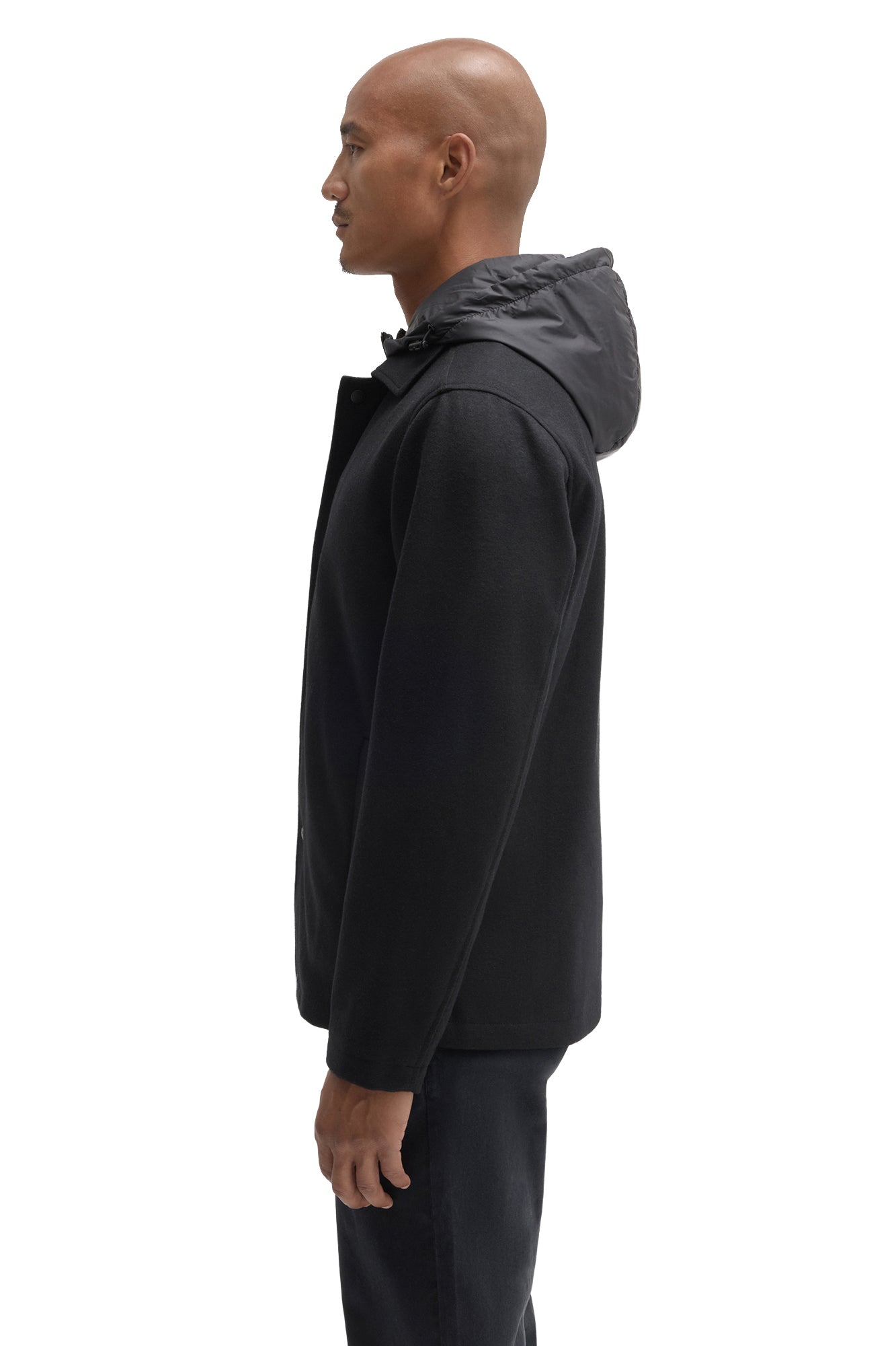 Robert Barakett men's black hooded jacket showing raised hood, snap placket edge and straight sleeve, side view