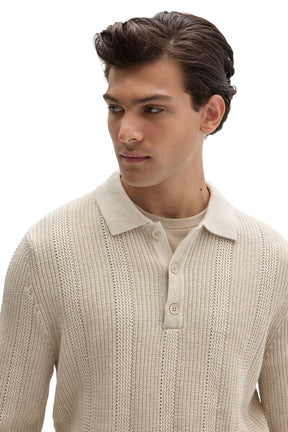 Close-up of men's cream textured knit long-sleeve polo with fold-over collar and tonal button placket by Robert Barakett
