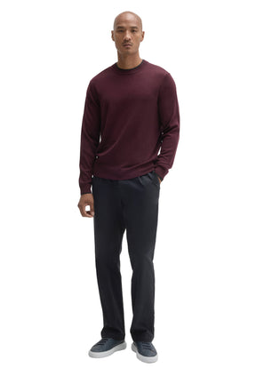 Men's full front outfit view featuring a burgundy crew neck long-sleeve sweater with ribbed hem and cuffs by Robert Barakett