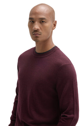 Robert Barakett men's angled close view of a burgundy crew neck long-sleeve sweater showing dark neckline trim and fine knit