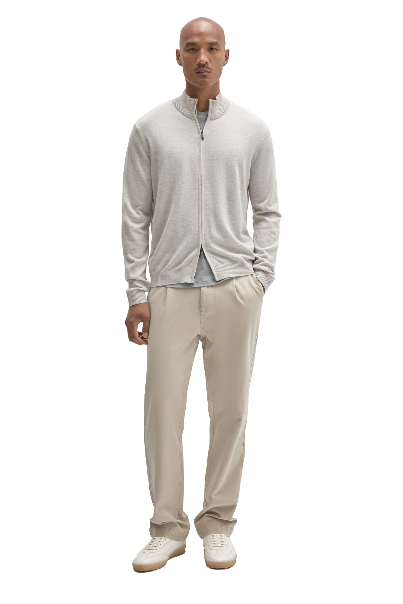 Robert Barakett men's full-body front view of a light beige full-zip knit long-sleeve knit sweater styled with neutral pants