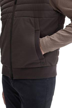 Men's pocket detail on dark taupe quilted vest with front zipper and rib-knit trim by Robert Barakett