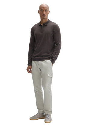 Men's full-body front view of a dark brown long sleeve polo shirt with collar and partial placket by Robert Barakett