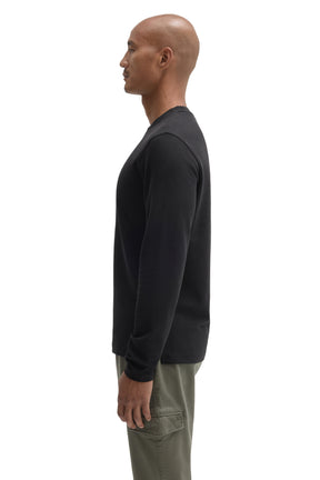Robert Barakett men's black long sleeve crew neck T-Shirt showing sleeve length and straight hem, side view