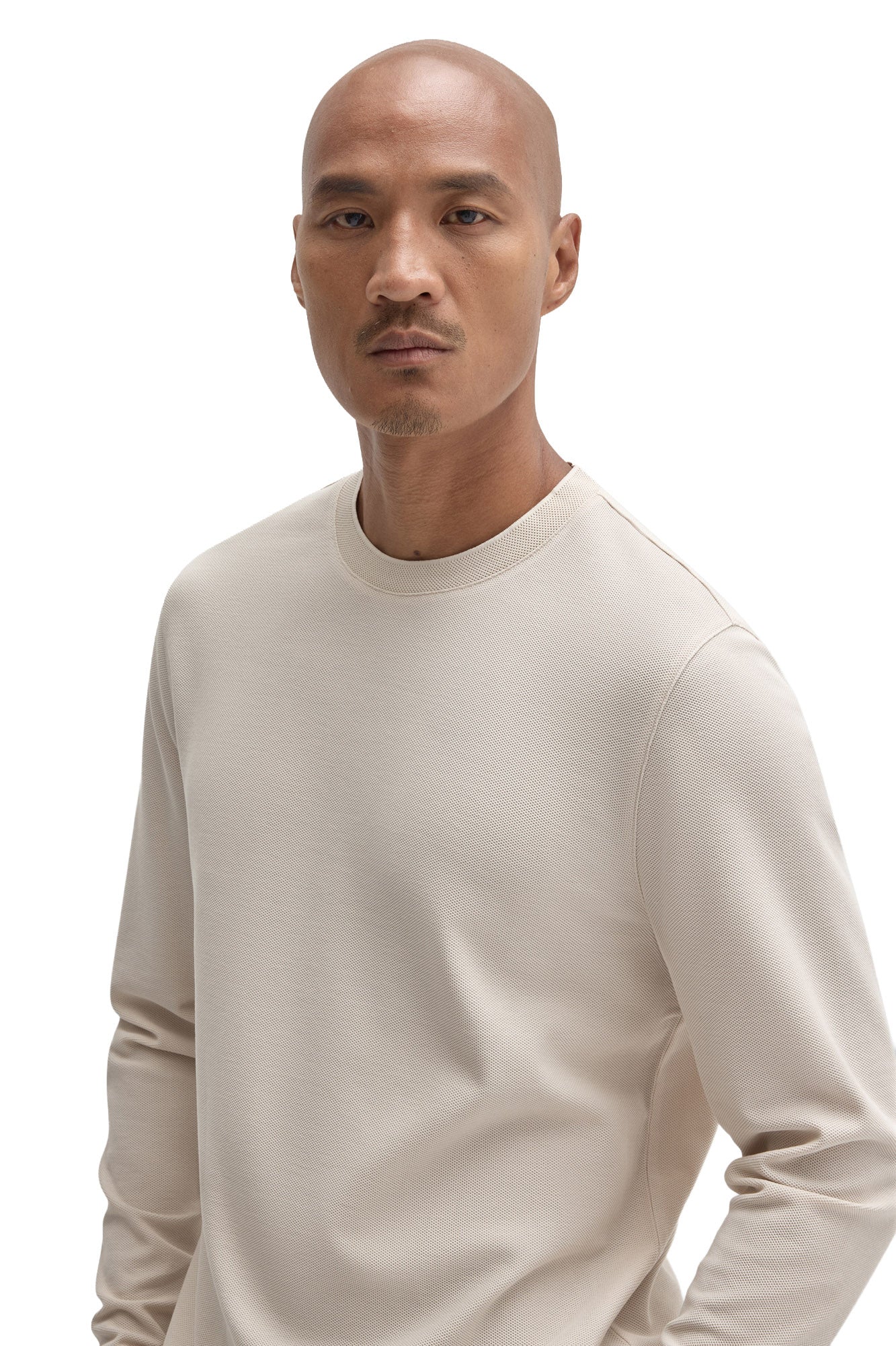 Men's close front view of an ivory long sleeve crewneck T-Shirt with fine textured surface by Robert Barakett